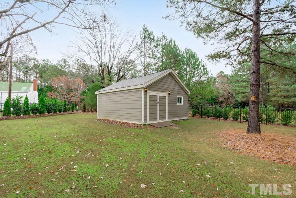 1217 Harrison Ridge Road Wake Forest, NC 27587 - Photo 24 of 30 a view of a house with a yard