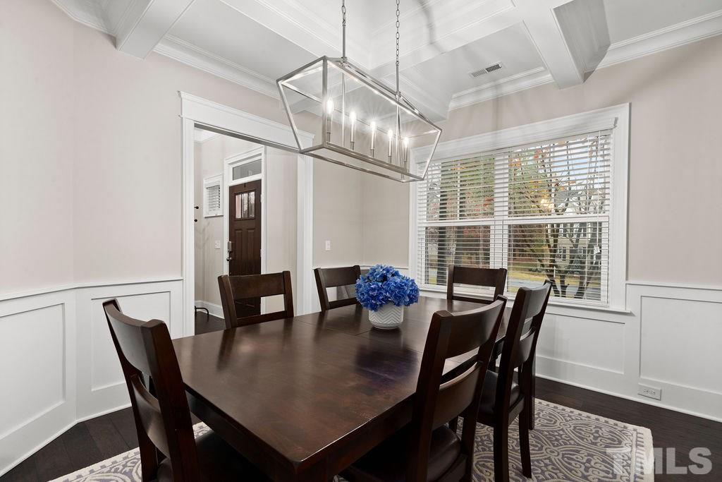 1217 Harrison Ridge Road Wake Forest, NC 27587 - Photo 3 of 30 a view of a dining room with furniture window and wooden floor