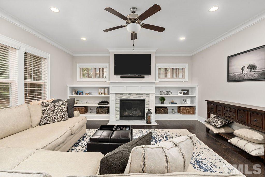 1217 Harrison Ridge Road Wake Forest, NC 27587 - Photo 6 of 30 a living room with furniture fireplace and flat screen tv