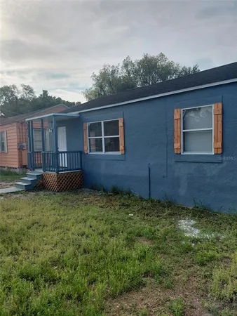 a backyard of a house with lots of green space