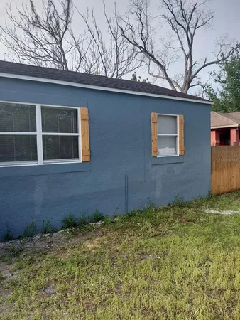 a view of a house with a large window