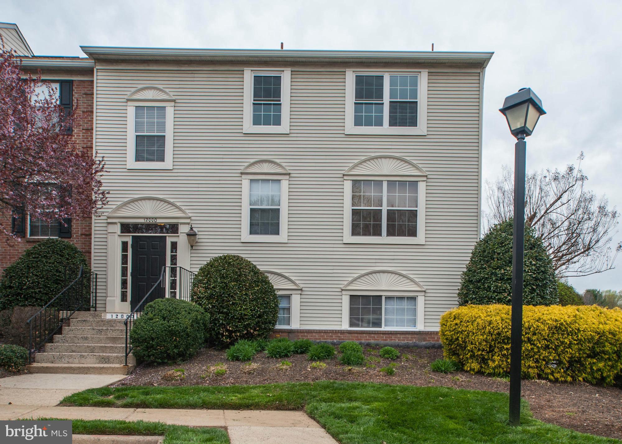 12000 Golf Ridge Court, Unit 352 Fairfax, VA 22033 - Photo 2 of 29 a front view of a house with garden