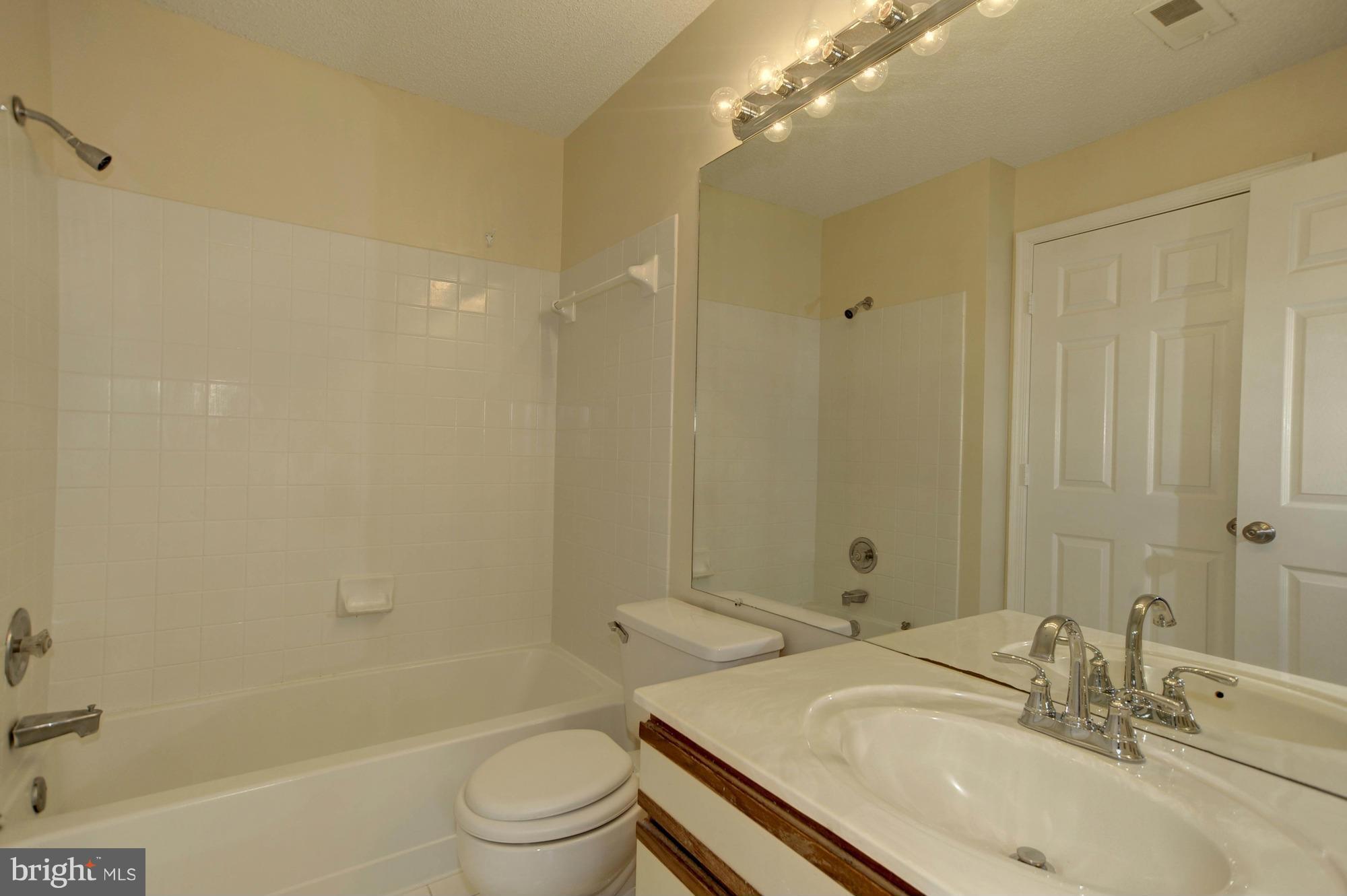 12000 Golf Ridge Court, Unit 352 Fairfax, VA 22033 - Photo 16 of 29 a bathroom with a sink and a mirror