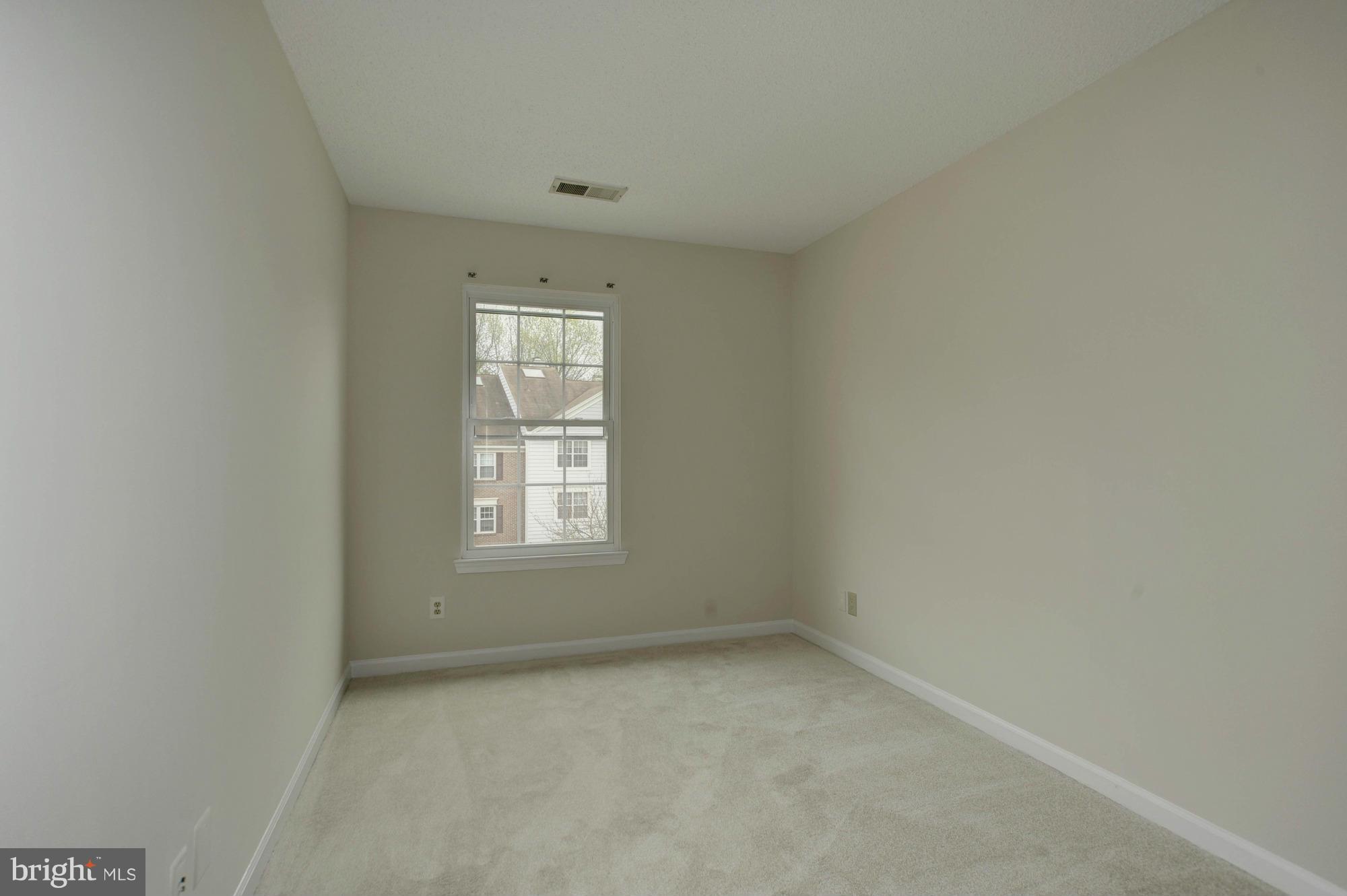 12000 Golf Ridge Court, Unit 352 Fairfax, VA 22033 - Photo 19 of 29 an empty room with a window