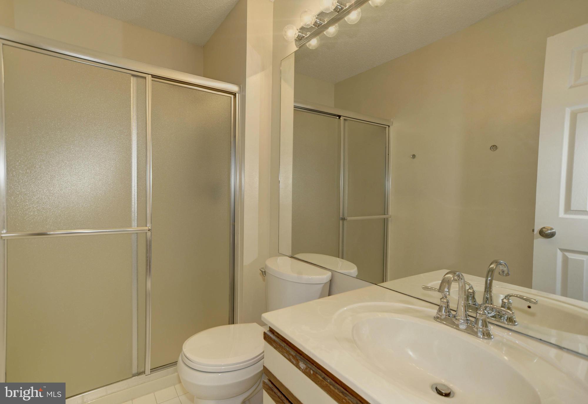 12000 Golf Ridge Court, Unit 352 Fairfax, VA 22033 - Photo 21 of 29 a bathroom with a sink toilet and shower