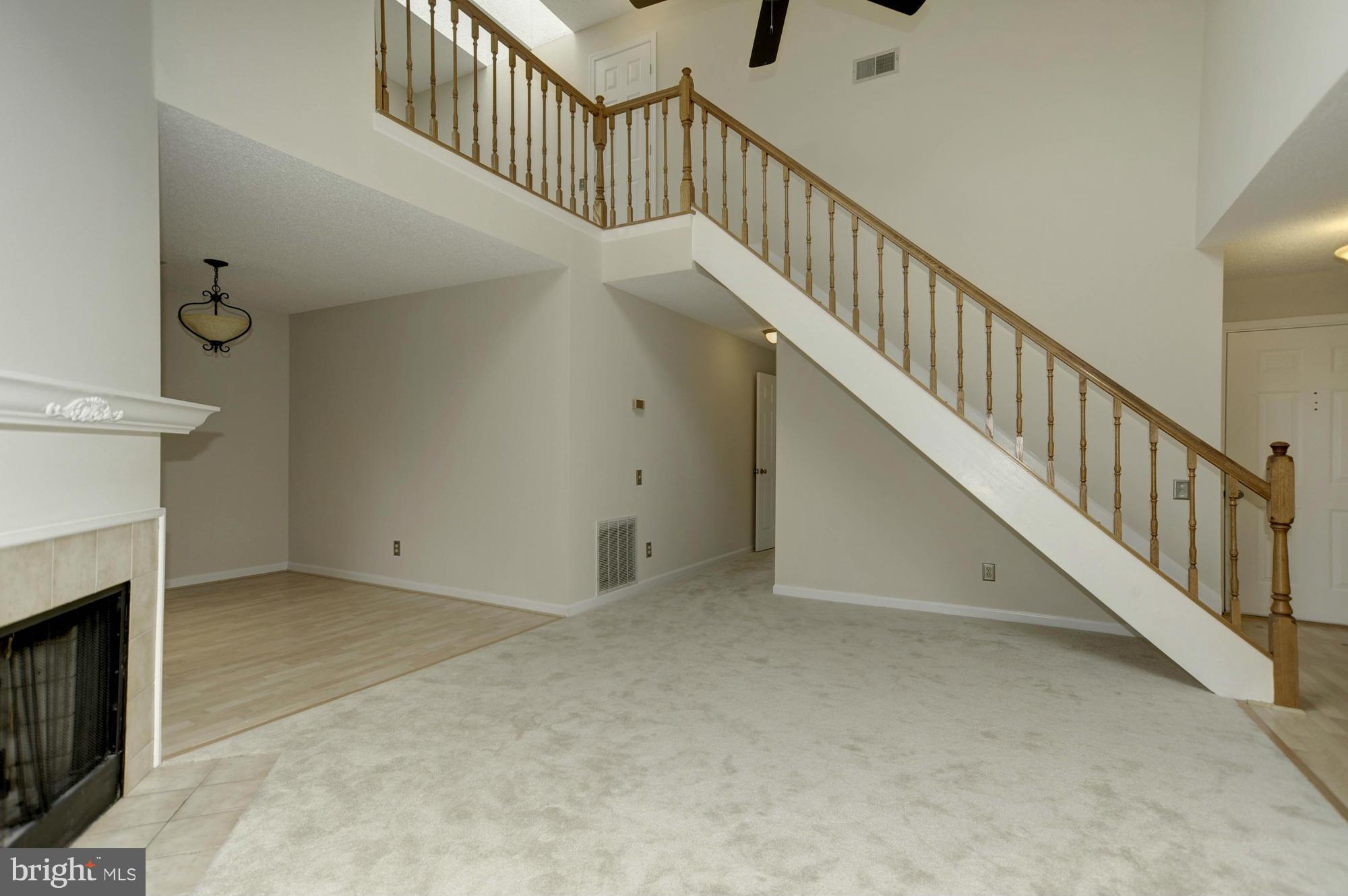 12000 Golf Ridge Court, Unit 352 Fairfax, VA 22033 - Photo 6 of 29 a view of staircase with fireplace
