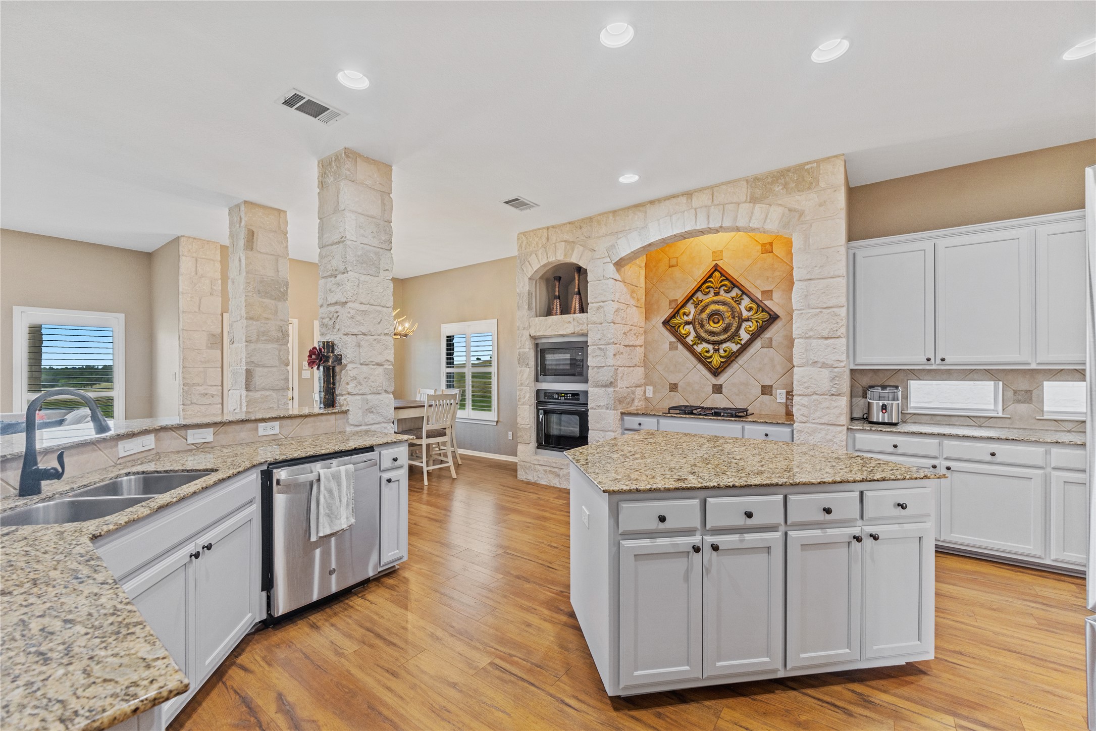 20145 Janak Road Coupland, TX 78615 - Photo 10 of 40 A chef's kitchen boasts stone accents and recently painted cabinets.