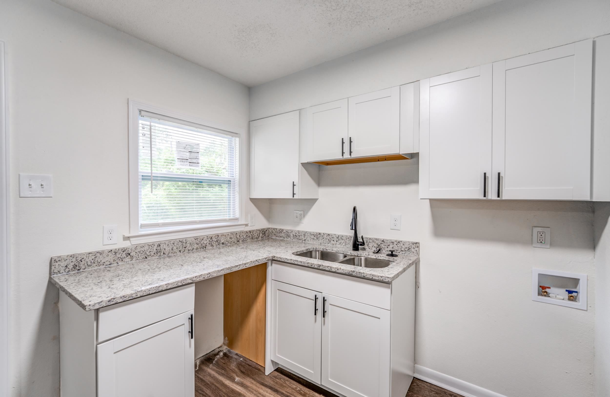 5341 Millbranch Road Memphis, TN 38116 - Photo 11 of 29 a kitchen with stainless steel appliances granite countertop a sink stove and cabinets