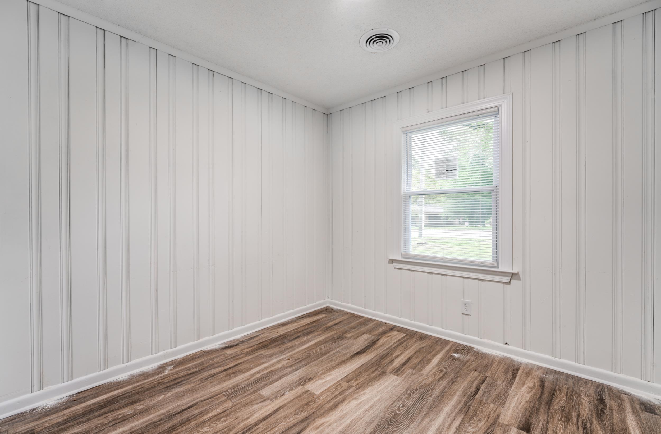 5341 Millbranch Road Memphis, TN 38116 - Photo 18 of 29 an empty room with windows