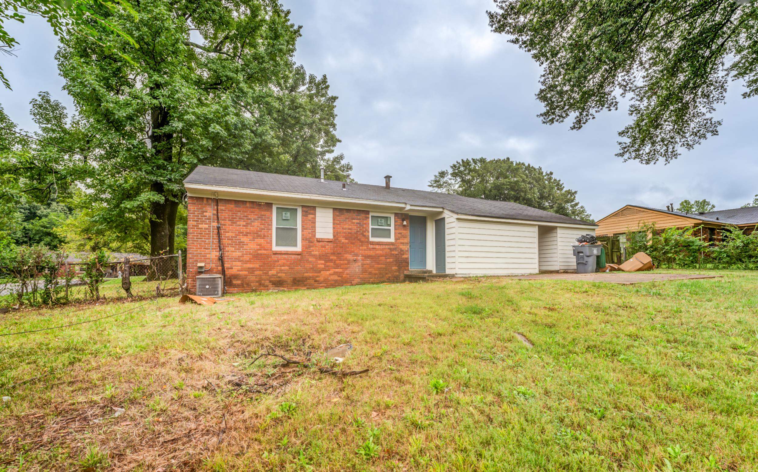 5341 Millbranch Road Memphis, TN 38116 - Photo 29 of 29 a house with trees in the background