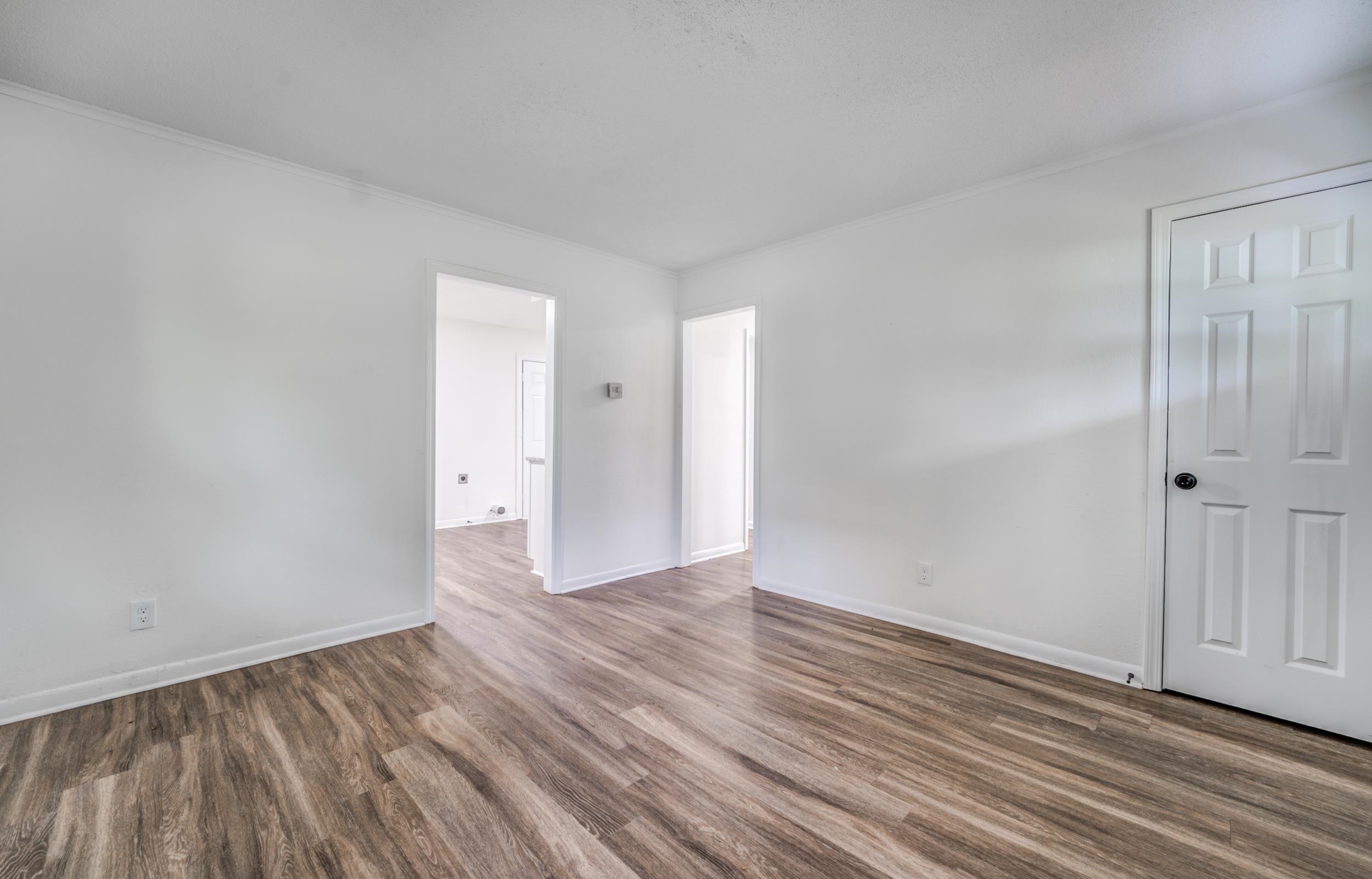 5341 Millbranch Road Memphis, TN 38116 - Photo 5 of 29 a view of an empty room and wooden floor