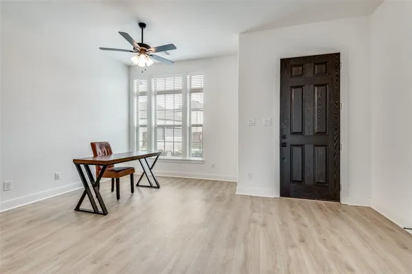 a view of a livingroom with furniture and wooden floor