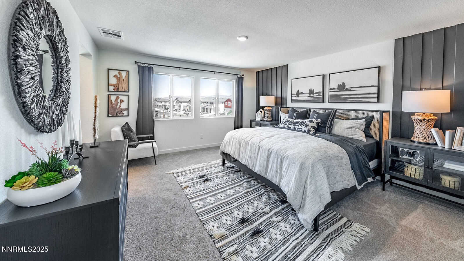 7489 Capstone Drive Reno, NV 89506 - Photo 14 of 25 a bedroom with a bed potted plant and the view of mirror