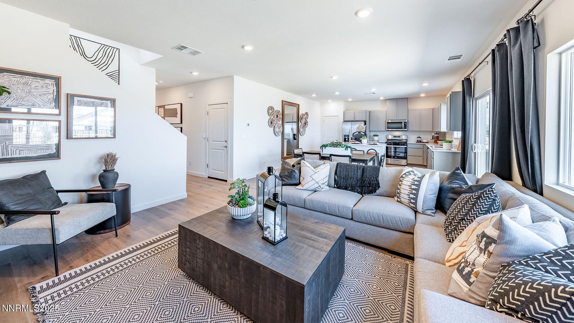 7489 Capstone Drive Reno, NV 89506 - Photo 2 of 25 a living room with furniture kitchen view and a window