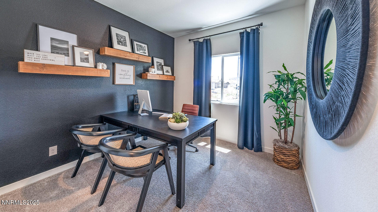7489 Capstone Drive Reno, NV 89506 - Photo 23 of 25 a view of a dining room with furniture and a potted plant
