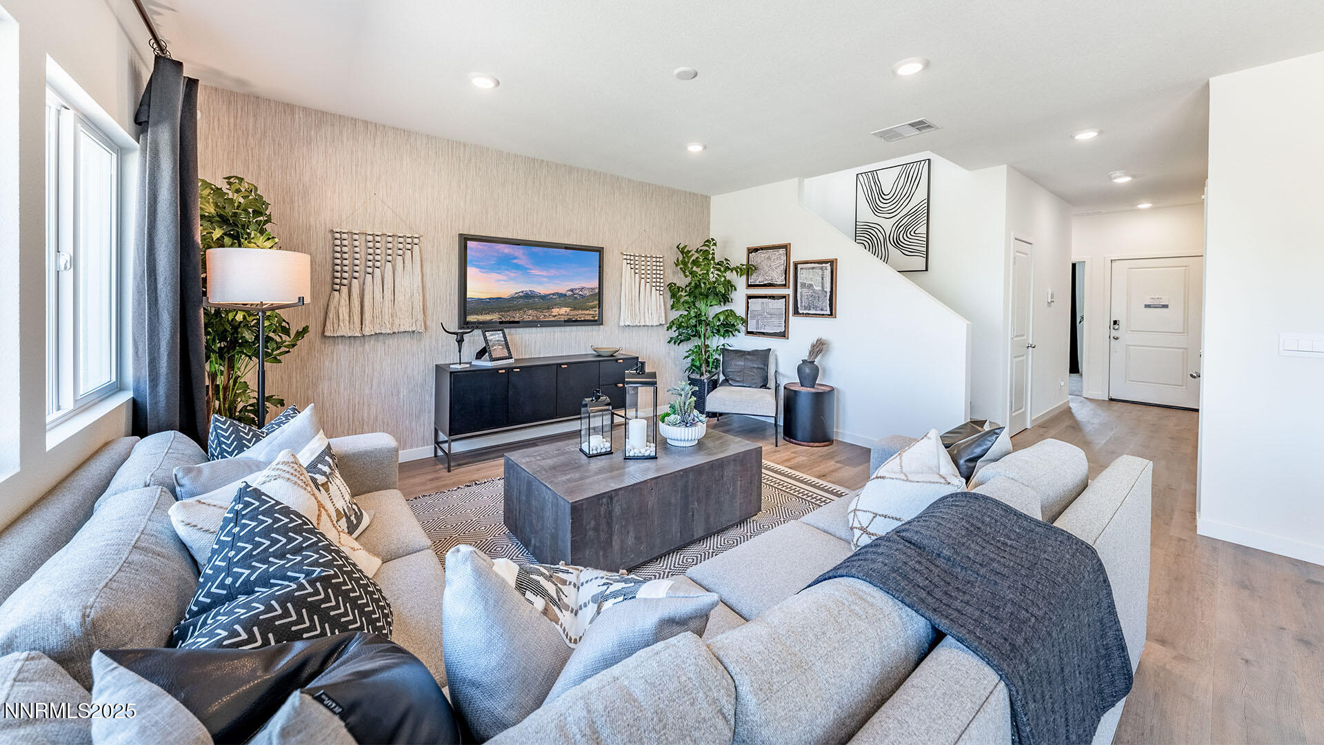 7489 Capstone Drive Reno, NV 89506 - Photo 4 of 25 a living room with furniture and a flat screen tv