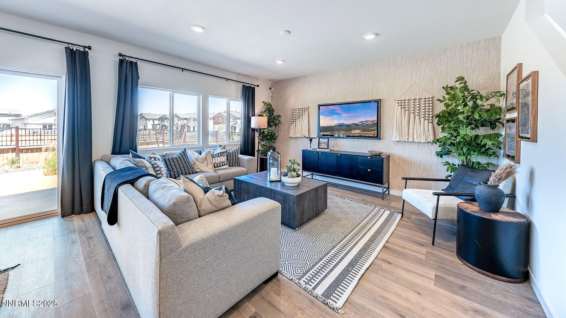 7489 Capstone Drive Reno, NV 89506 - Photo 5 of 25 a living room with furniture and a potted plant