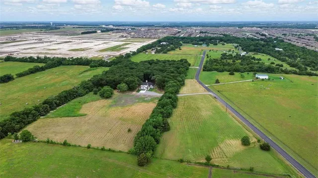 a view of a park with iron fence