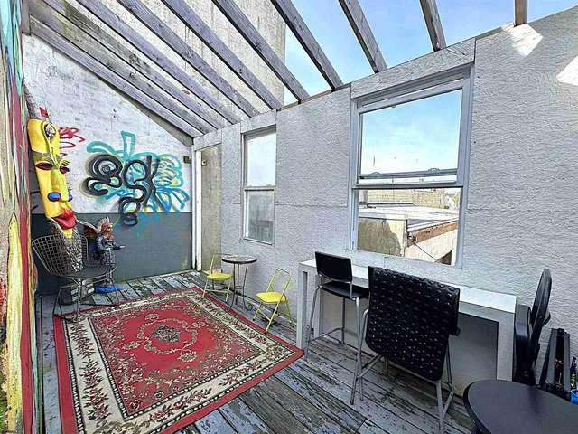 a living room with a rug