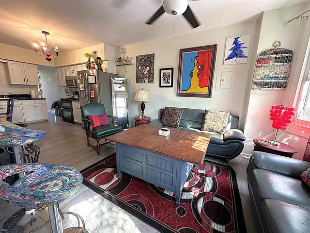 a bedroom with furniture and wooden floor