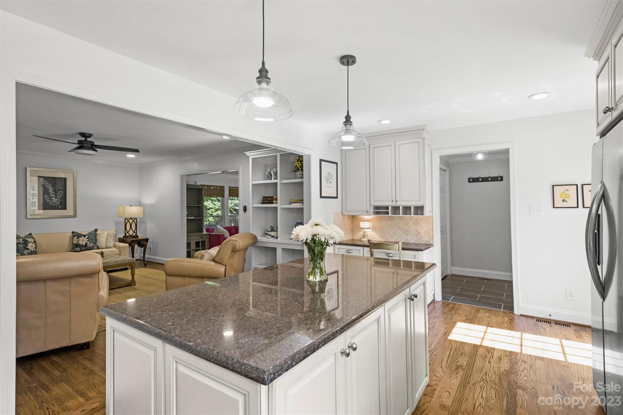 5943 Brace Road Charlotte, NC 28211 - Photo 11 of 36 a kitchen with stainless steel appliances granite countertop a sink refrigerator and cabinets