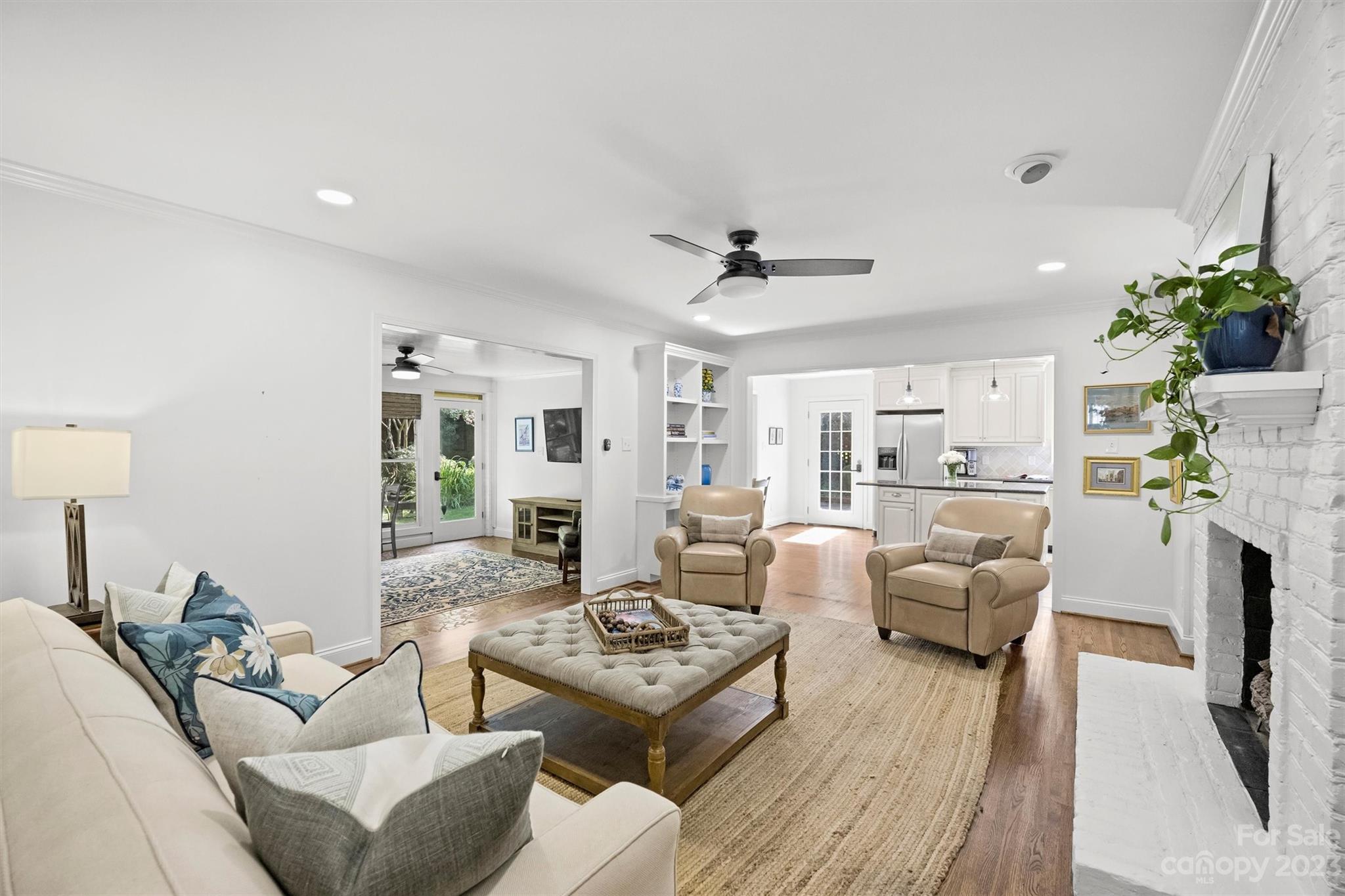 5943 Brace Road Charlotte, NC 28211 - Photo 16 of 36 a living room with furniture fireplace and a potted plant