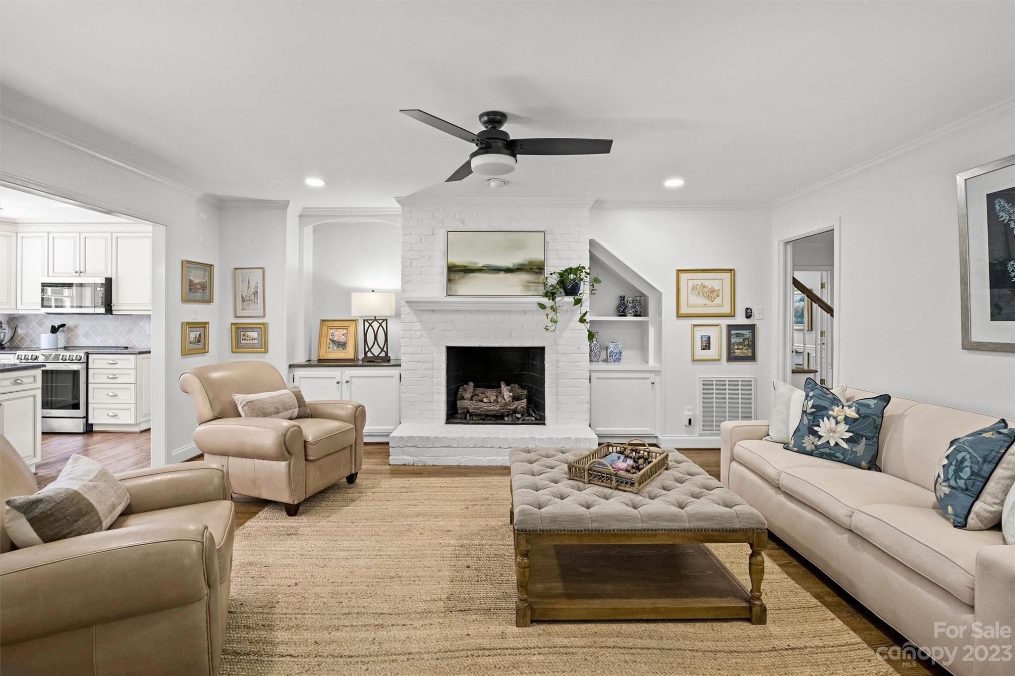 5943 Brace Road Charlotte, NC 28211 - Photo 17 of 36 a living room with furniture and a fireplace