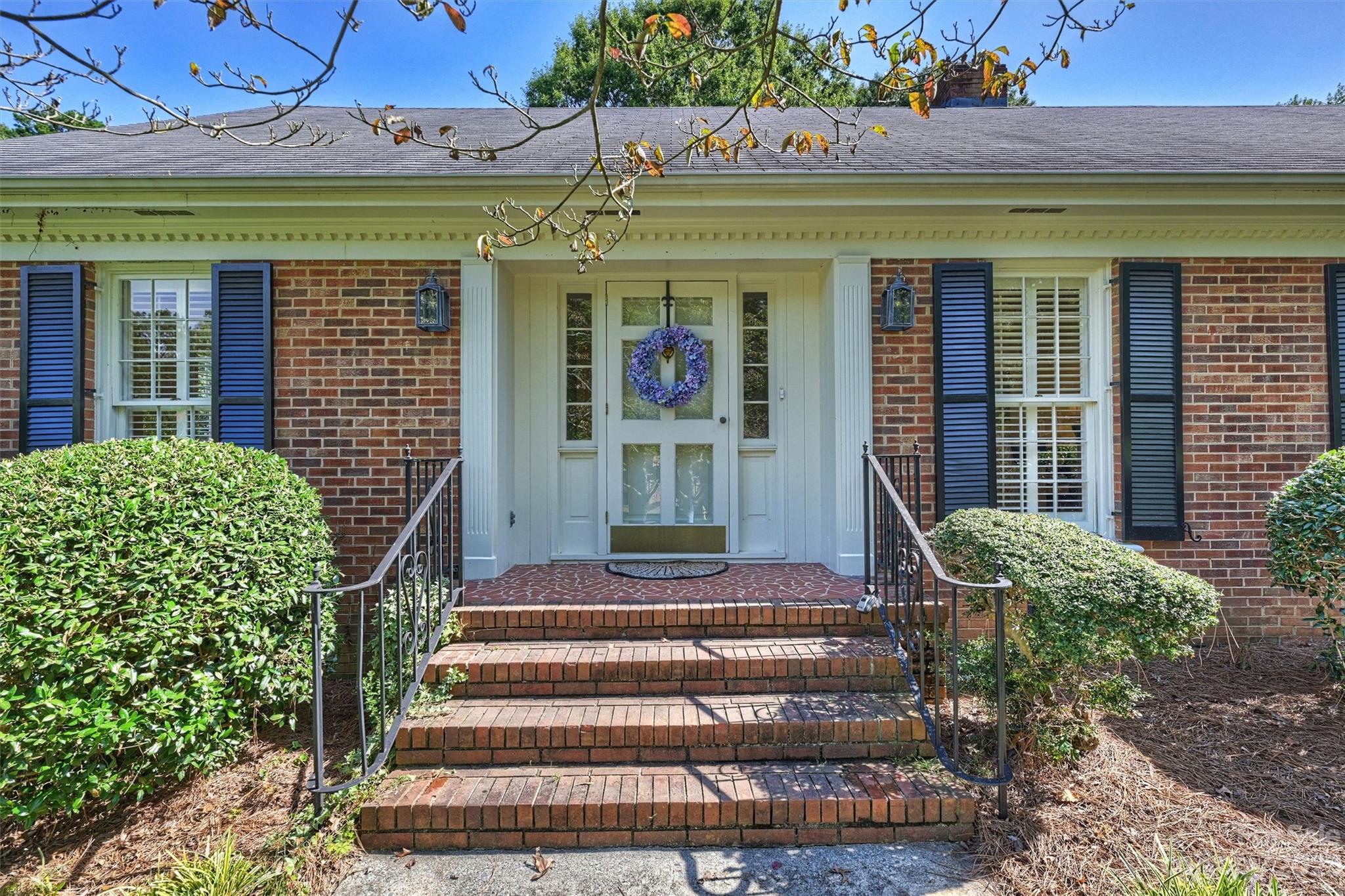 5943 Brace Road Charlotte, NC 28211 - Photo 2 of 36 a front view of a house with entryway and windows