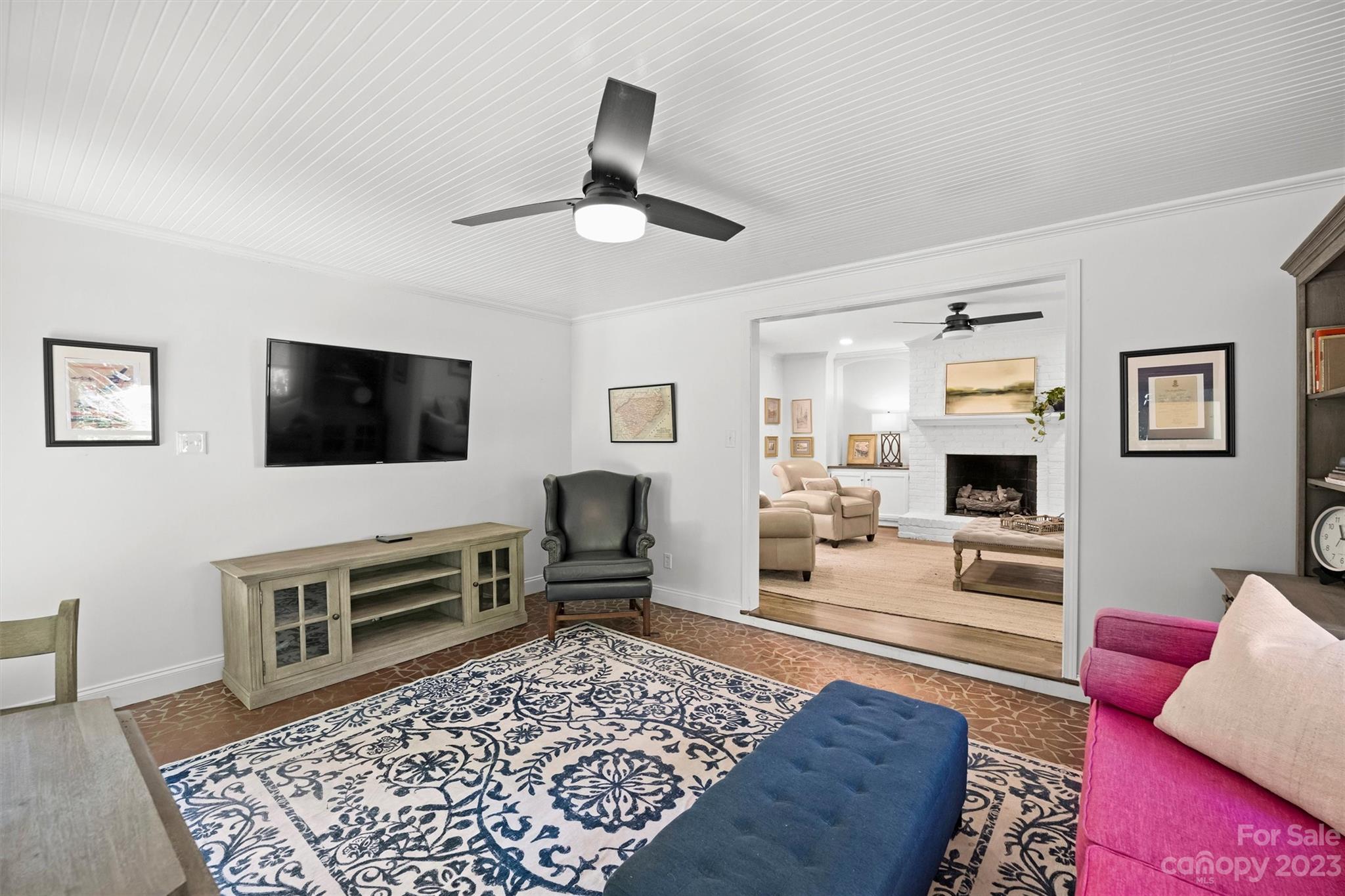 5943 Brace Road Charlotte, NC 28211 - Photo 22 of 36 a living room with furniture and a flat screen tv
