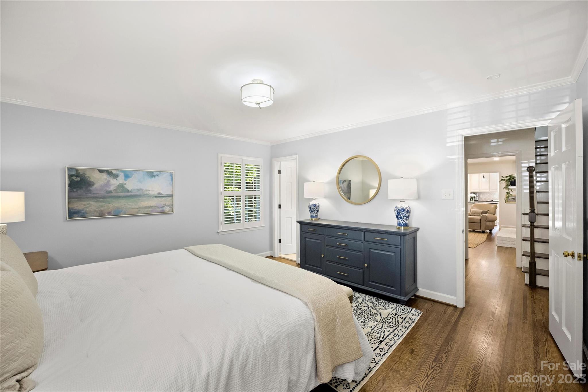 5943 Brace Road Charlotte, NC 28211 - Photo 24 of 36 a bed room with a bed mirror and a window