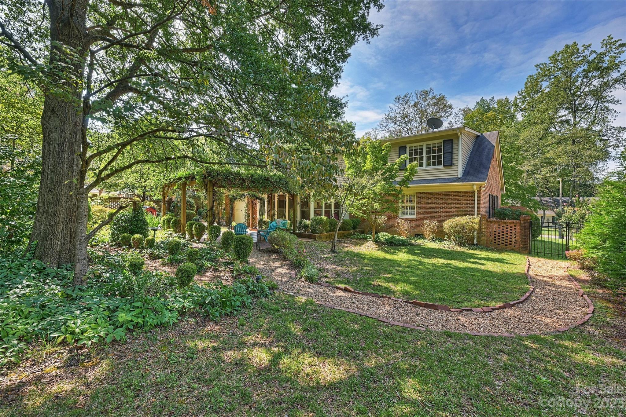 5943 Brace Road Charlotte, NC 28211 - Photo 35 of 36 a front view of a house with a yard