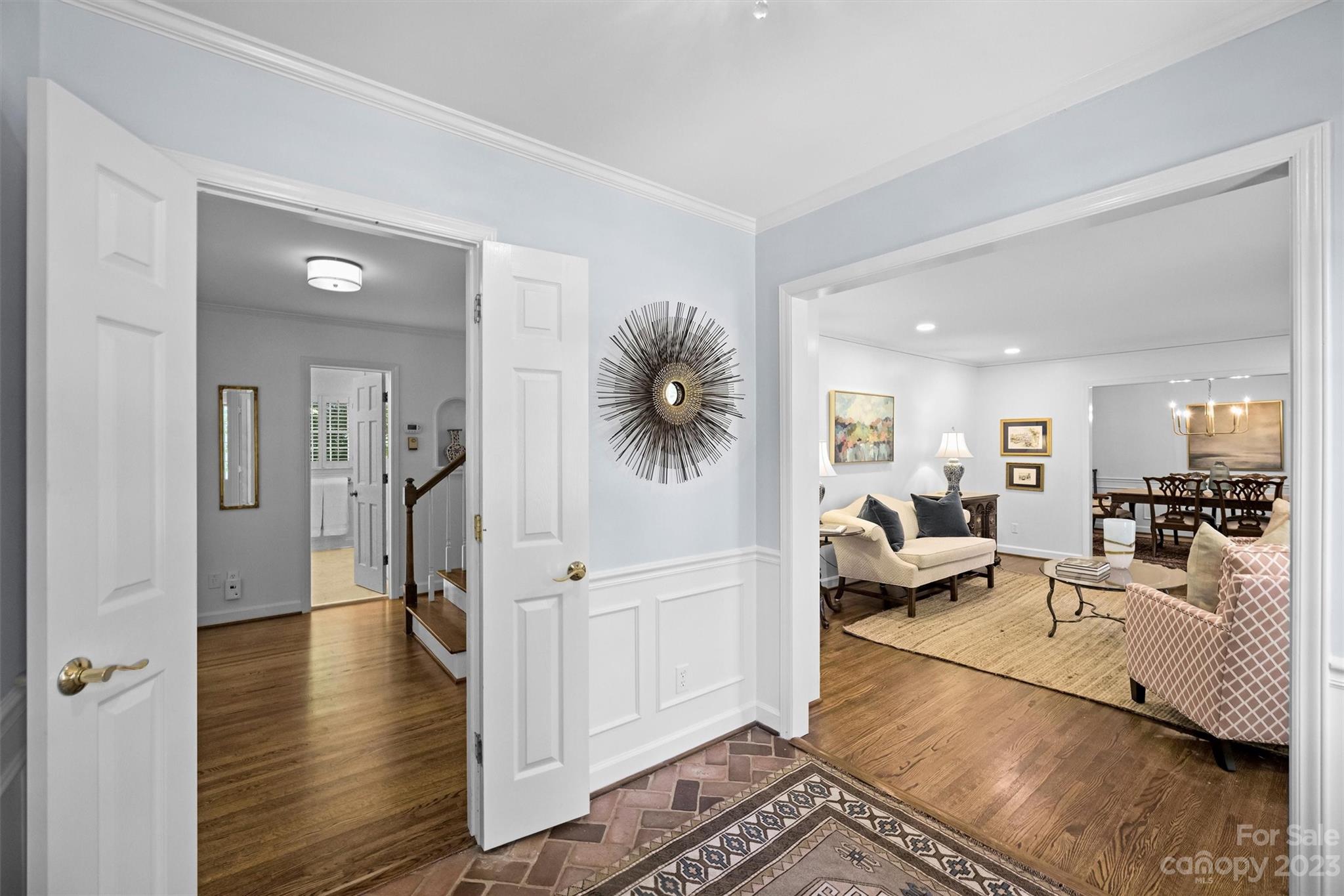 5943 Brace Road Charlotte, NC 28211 - Photo 4 of 36 a living room with furniture and a wooden floor
