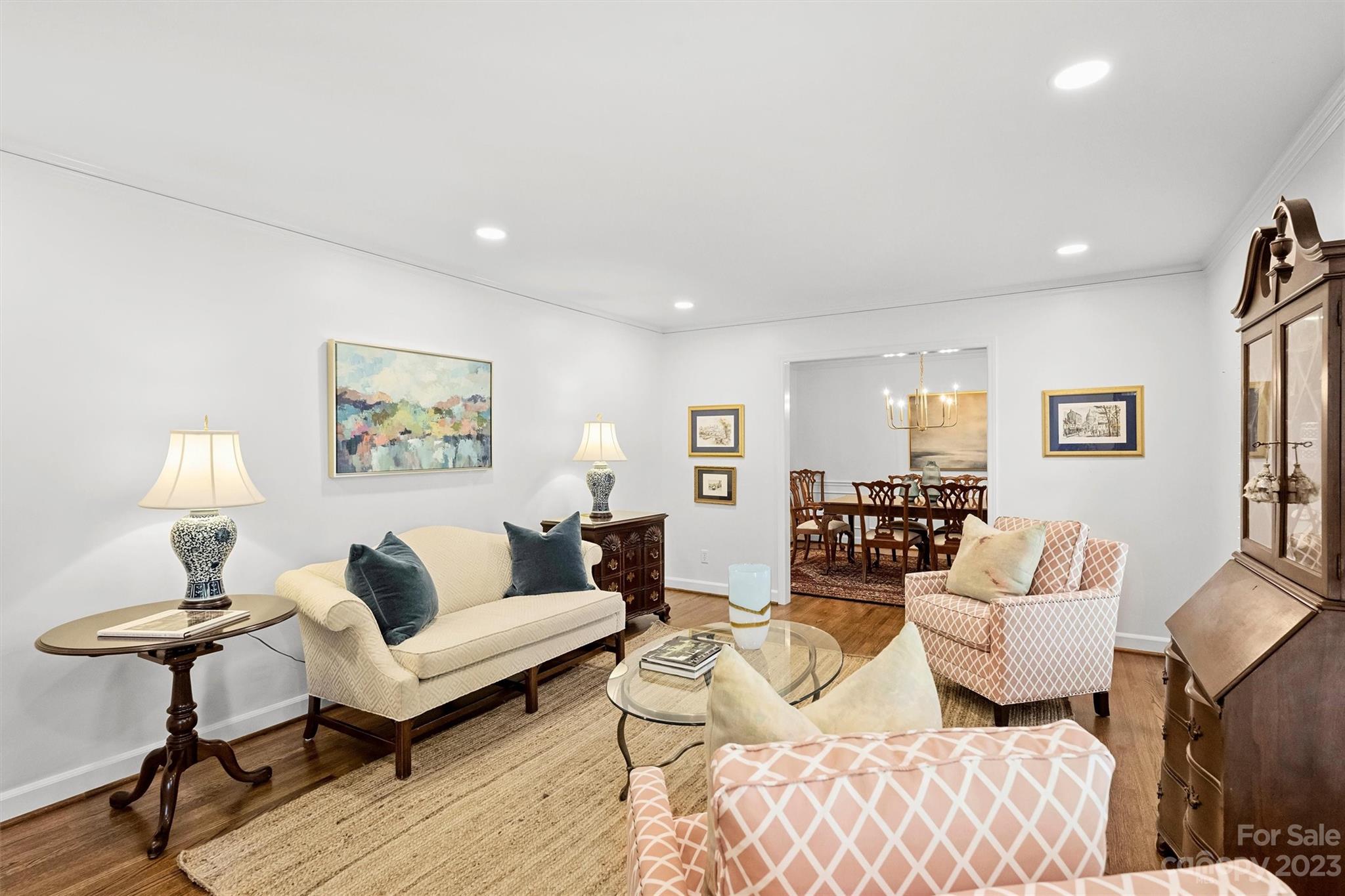 5943 Brace Road Charlotte, NC 28211 - Photo 7 of 36 a living room with furniture and a lamp