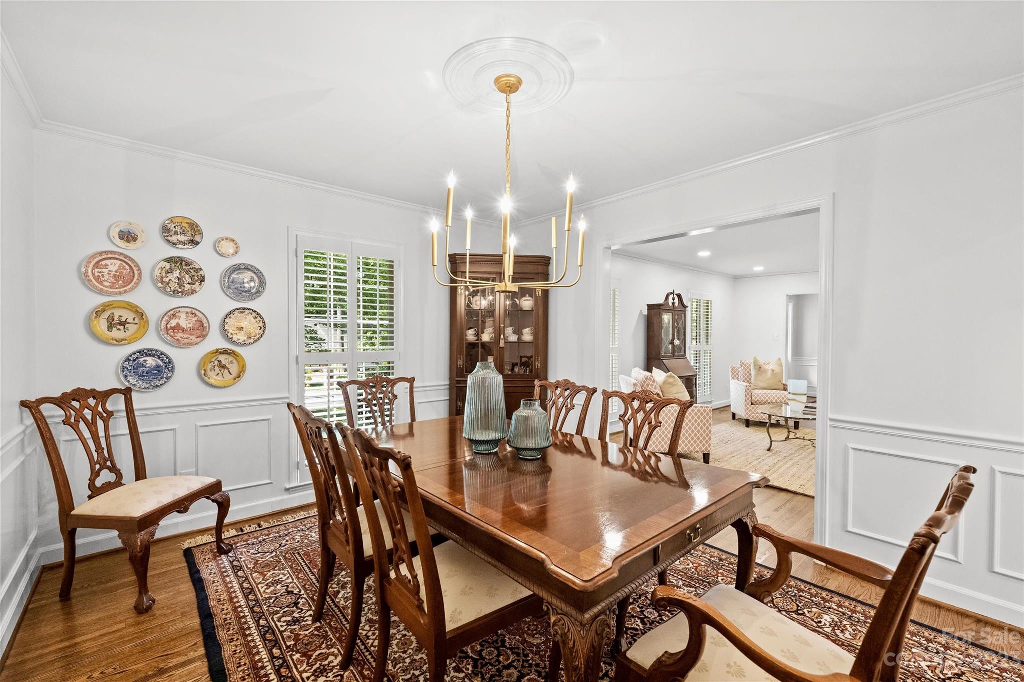 5943 Brace Road Charlotte, NC 28211 - Photo 8 of 36 a view of a dining room with furniture and wooden floor
