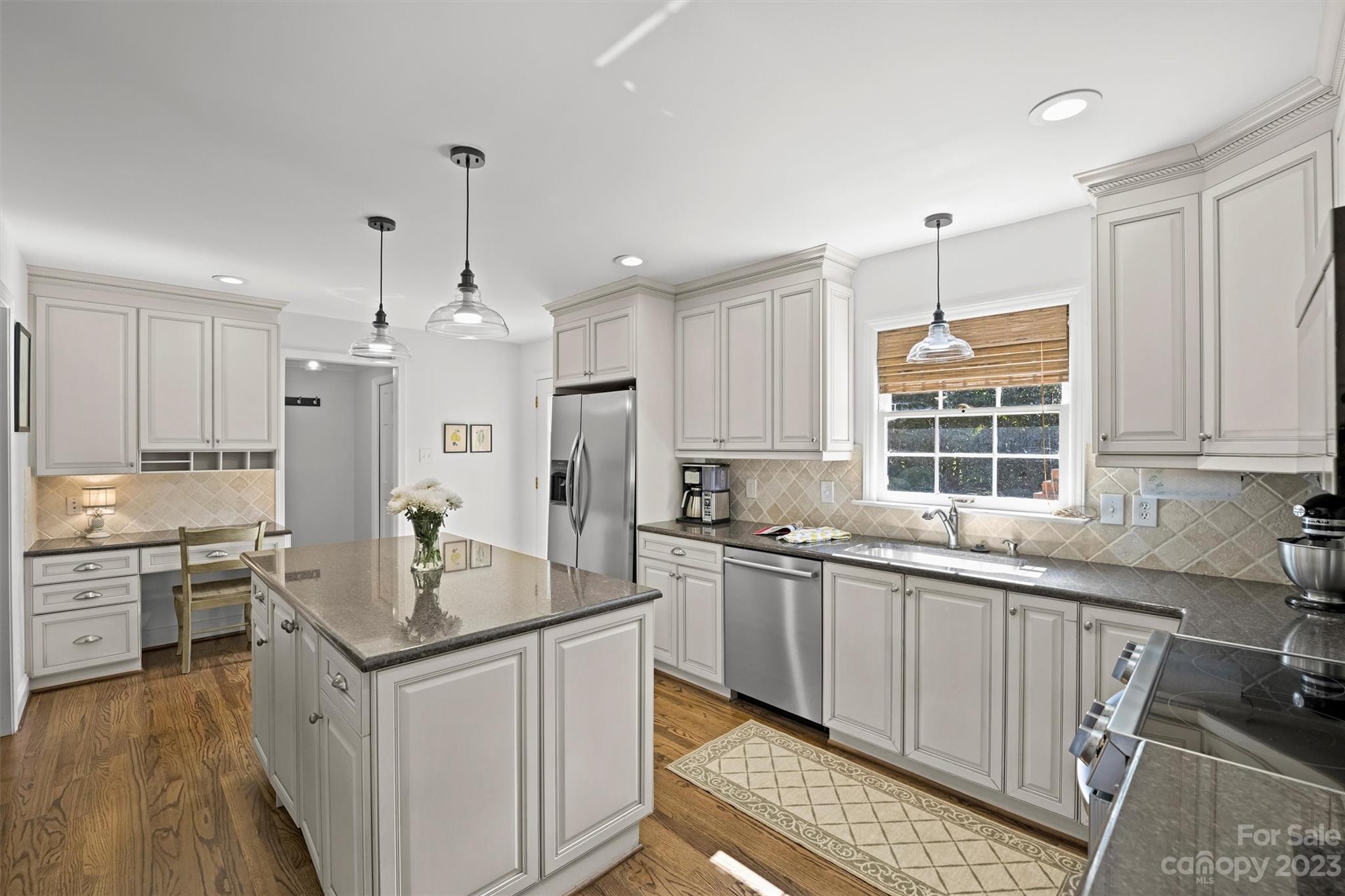 5943 Brace Road Charlotte, NC 28211 - Photo 9 of 36 a kitchen with stainless steel appliances granite countertop a sink stove and refrigerator