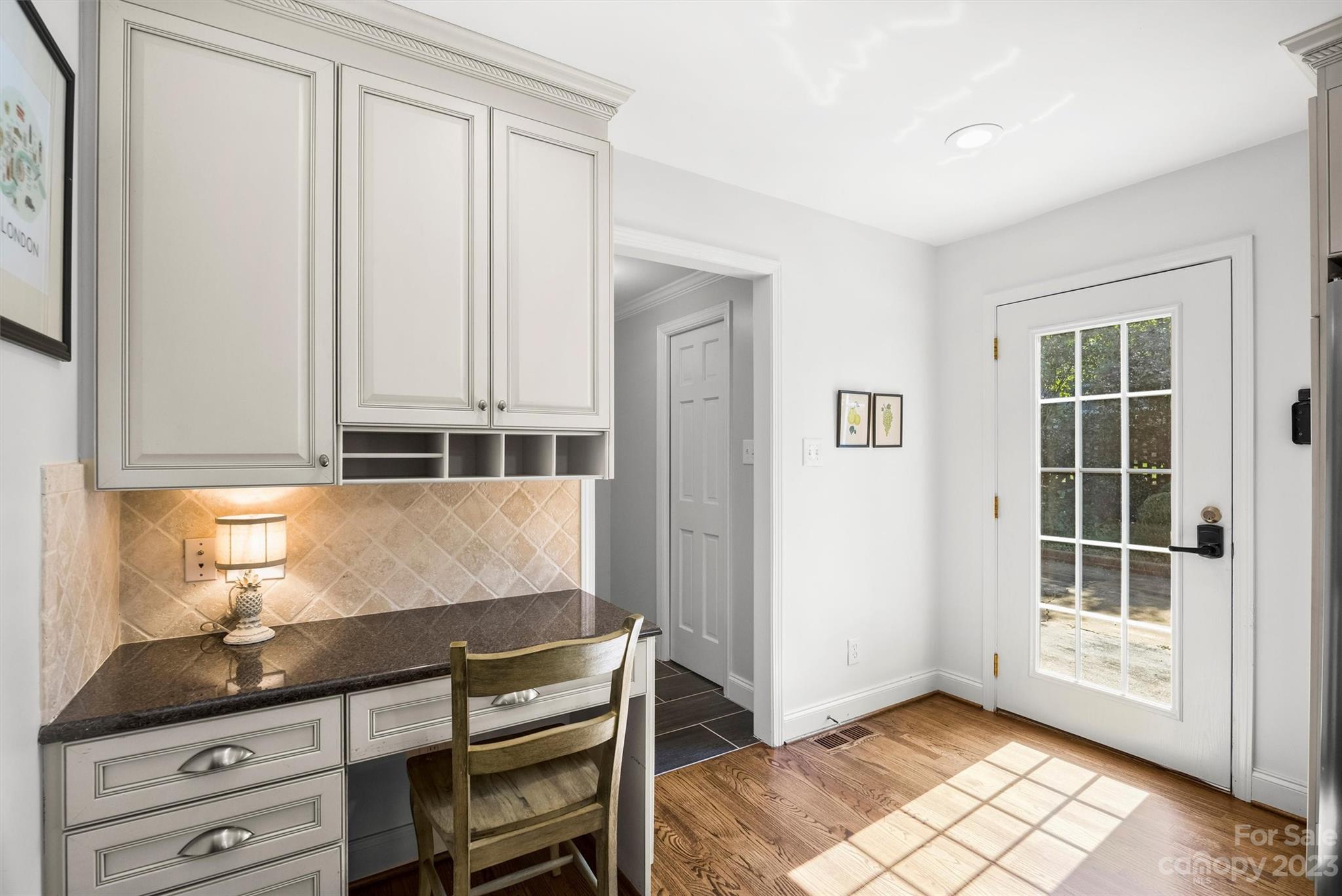 5943 Brace Road Charlotte, NC 28211 - Photo 10 of 36 a bathroom with a granite countertop sink and a window
