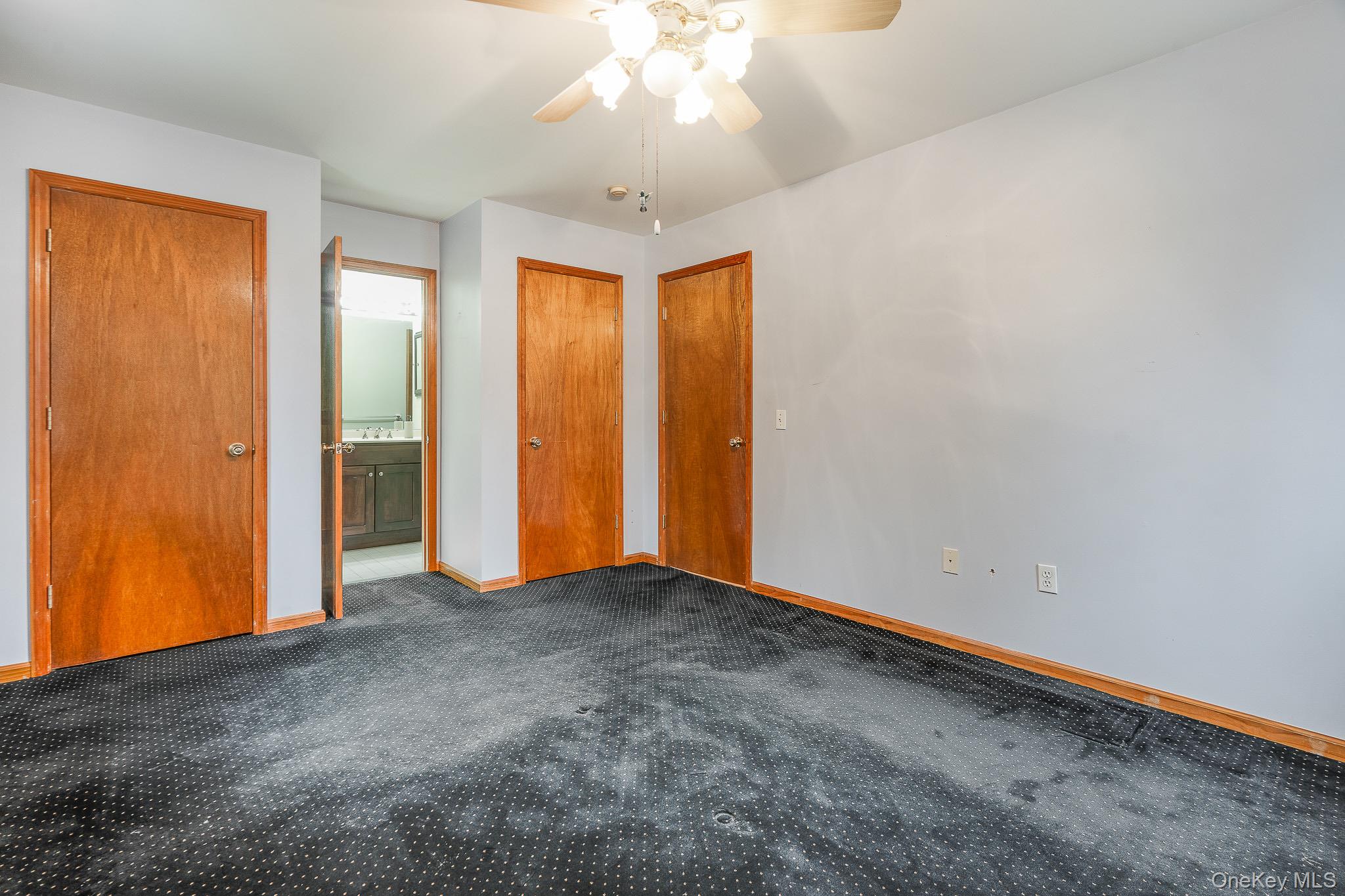 1 Mountain View Road Fishkill, NY 12524 - Photo 12 of 35 an empty room with closet and chandelier fan