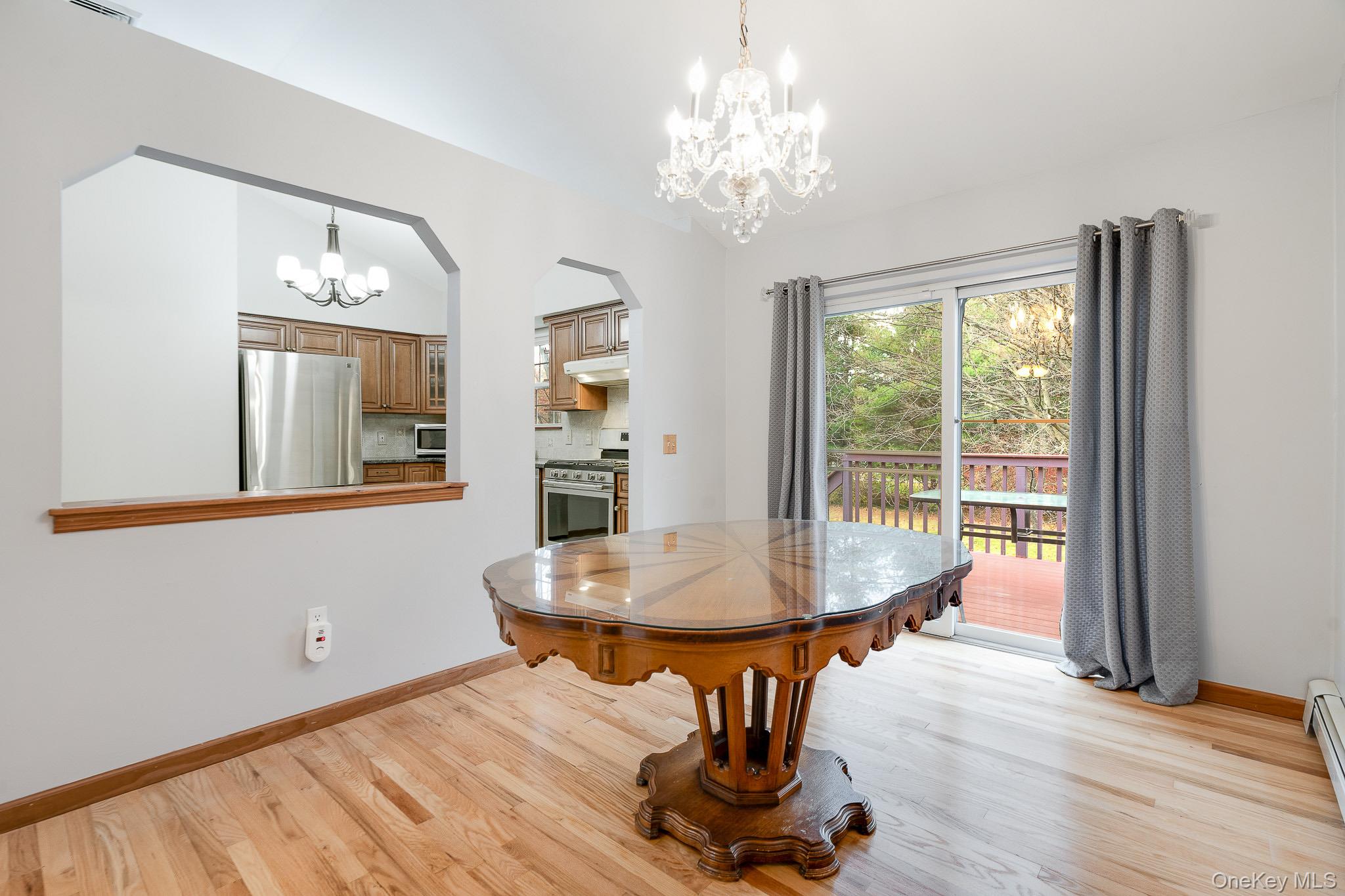 1 Mountain View Road Fishkill, NY 12524 - Photo 6 of 35 a dining room with furniture a chandelier and wooden floor
