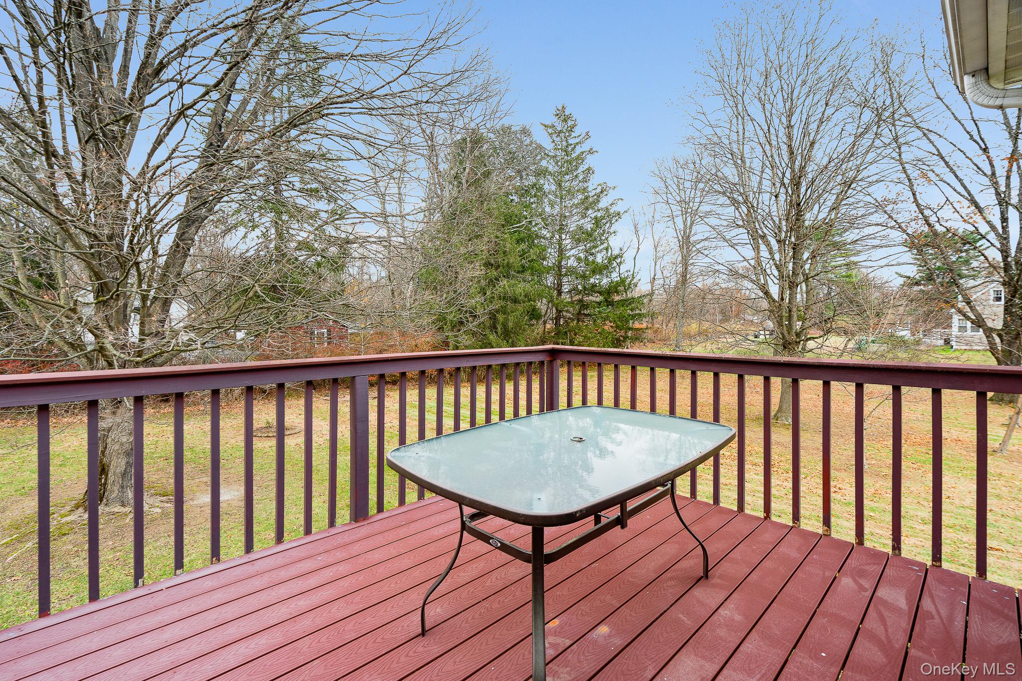 1 Mountain View Road Fishkill, NY 12524 - Photo 7 of 35 a balcony with wooden floor table and chairs