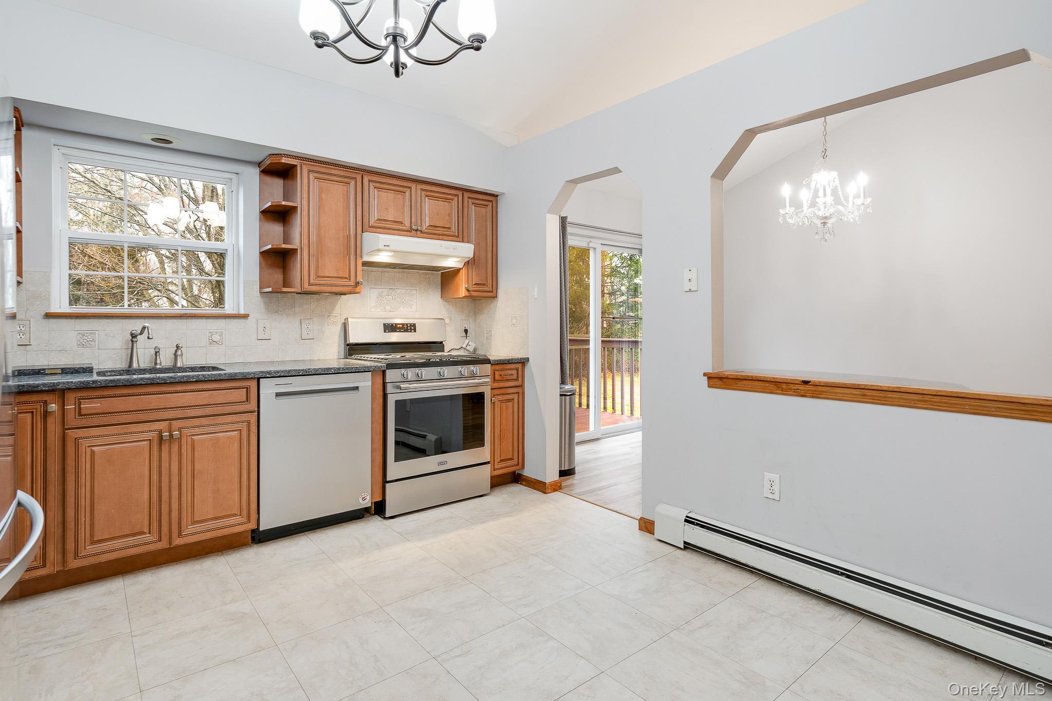 1 Mountain View Road Fishkill, NY 12524 - Photo 9 of 35 a kitchen with granite countertop white cabinets and white appliances