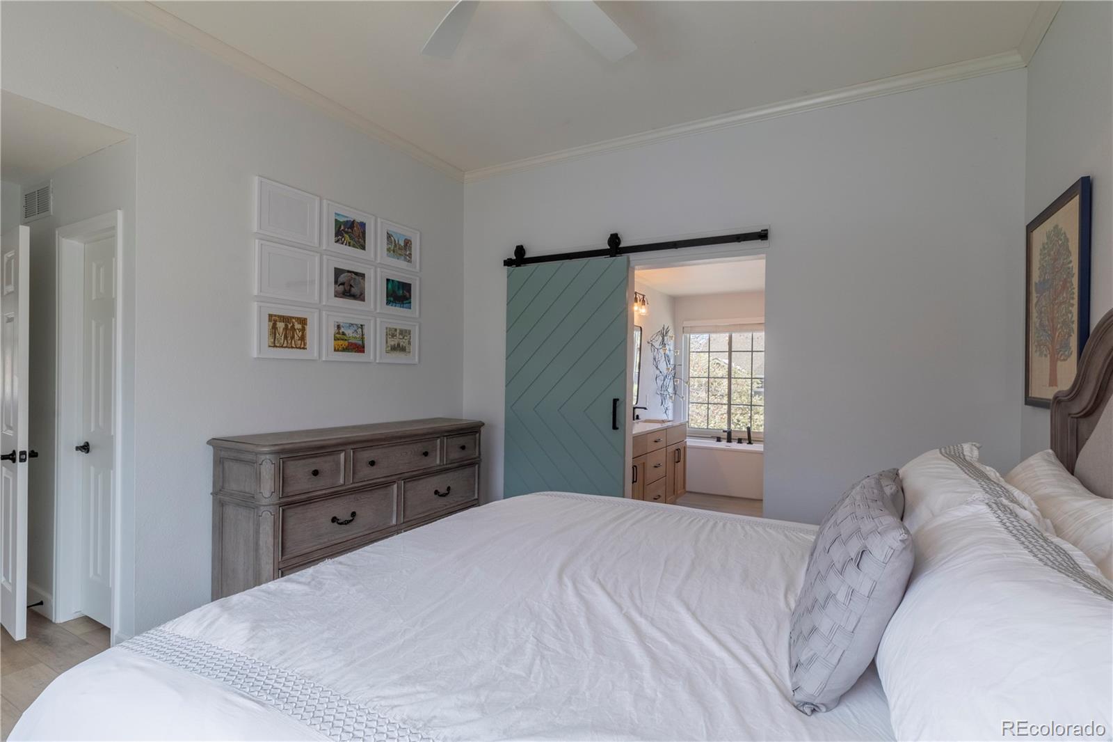294 West Willowick Circle Highlands Ranch, CO 80129 - Photo 11 of 37 a bedroom with a bed and a window