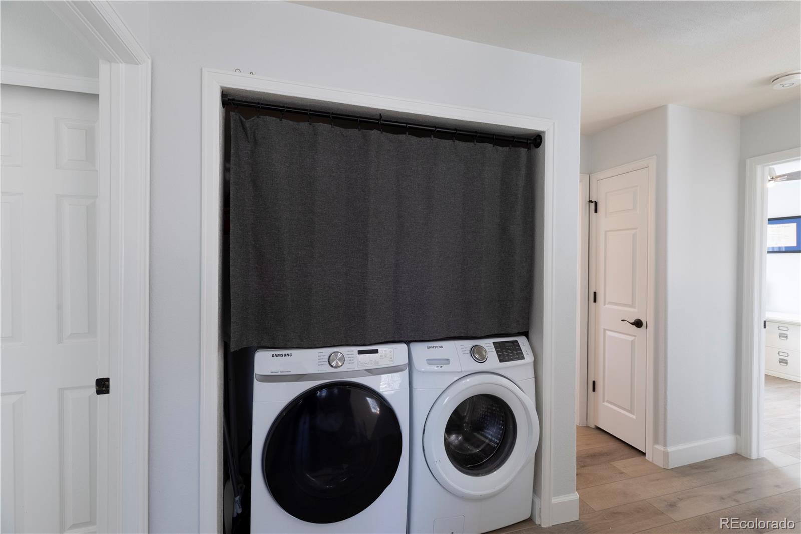 294 West Willowick Circle Highlands Ranch, CO 80129 - Photo 15 of 37 a utility room with dryer and washer
