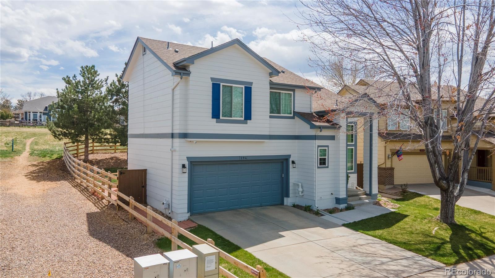 294 West Willowick Circle Highlands Ranch, CO 80129 - Photo 2 of 37 a front view of a house with garden