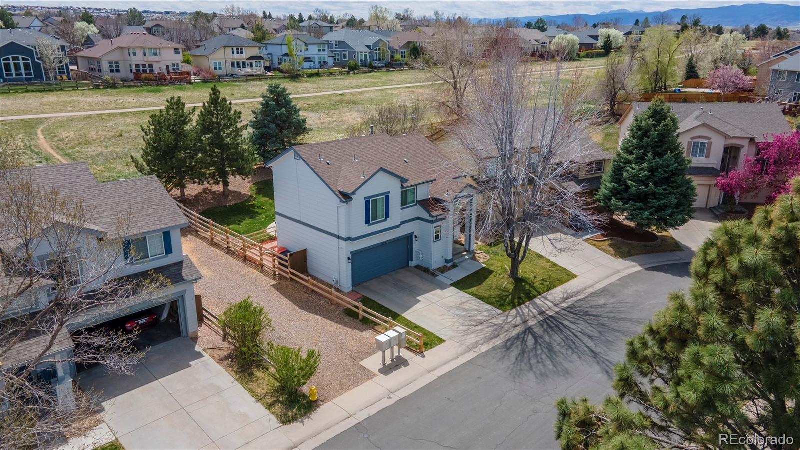 294 West Willowick Circle Highlands Ranch, CO 80129 - Photo 32 of 37 an aerial view of a house with outdoor space lake view and mountain view