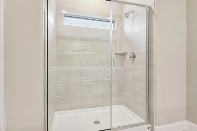 a bathroom with double sink and a mirror