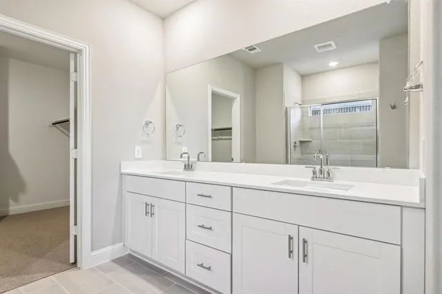 an empty room with fan and entrance