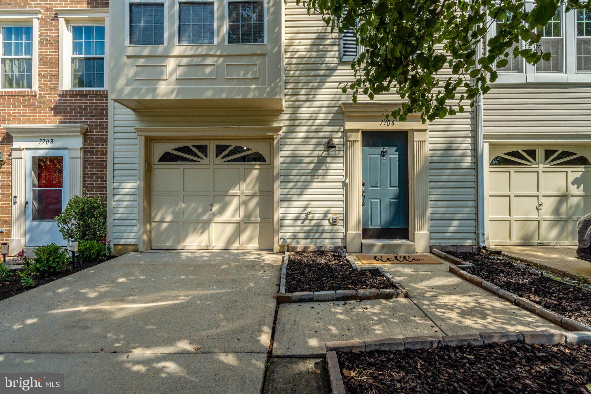 7706 Shadowcreek Terrace Springfield, VA 22153 - Photo 3 of 30 a front view of a house with a yard