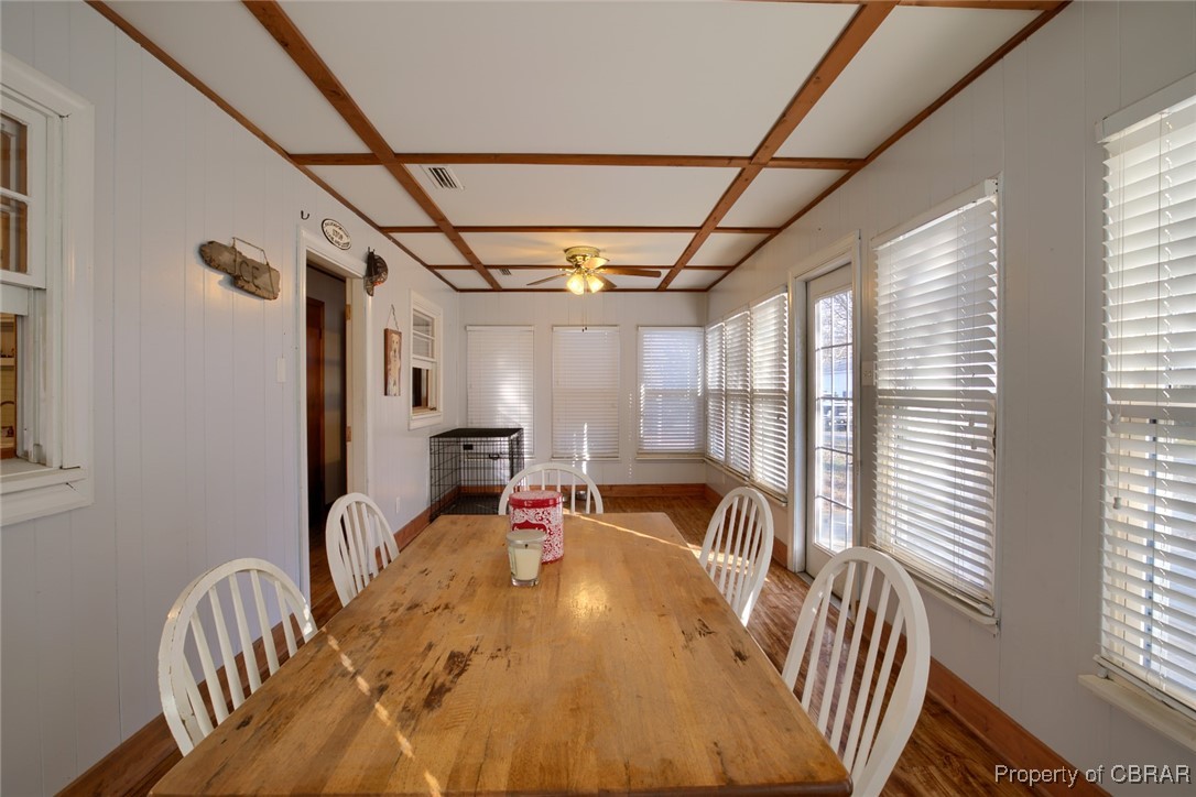 954 Carlton Road Wake, VA 23176 - Photo 19 of 25 Dining space with ceiling fan, wood-type flooring, and coffered ceiling