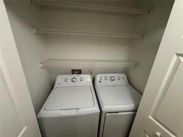 a utility room with dryer and washer
