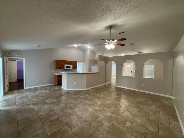 a view of a livingroom with a kitchen